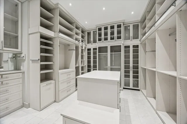 a view of living room with furniture and windows