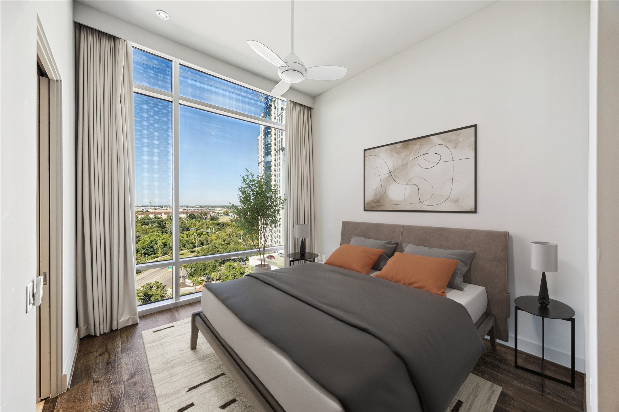 3331 D'Amico Street, Unit 1003 Houston, TX 77019 - Photo 26 of 46 a bedroom with a bed and a large window