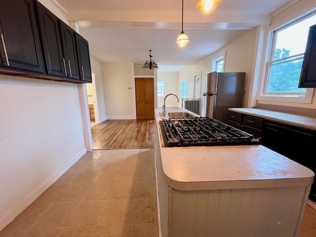 61 Center Street Bridgewater, MA 02324 - Photo 11 of 33 a kitchen with a sink and a stove top oven
