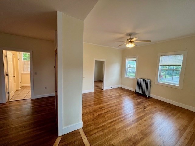 61 Center Street Bridgewater, MA 02324 - Photo 13 of 33 a view of an empty room with window and wooden floor
