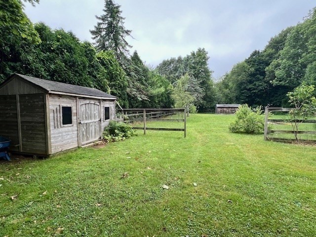 61 Center Street Bridgewater, MA 02324 - Photo 29 of 33 a view of a backyard with small cabin