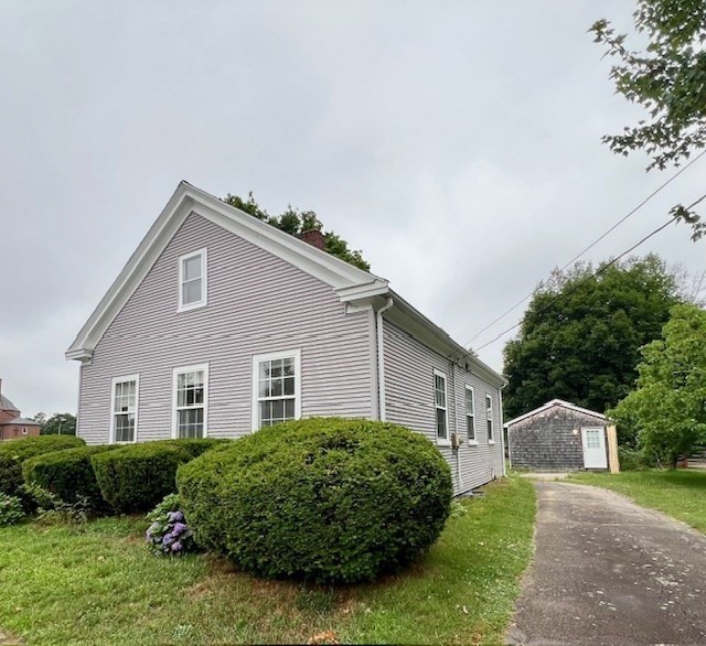 61 Center Street Bridgewater, MA 02324 - Photo 3 of 33 a front view of a house with a garden