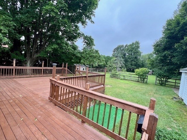 61 Center Street Bridgewater, MA 02324 - Photo 31 of 33 a view of a deck with two chairs and a table