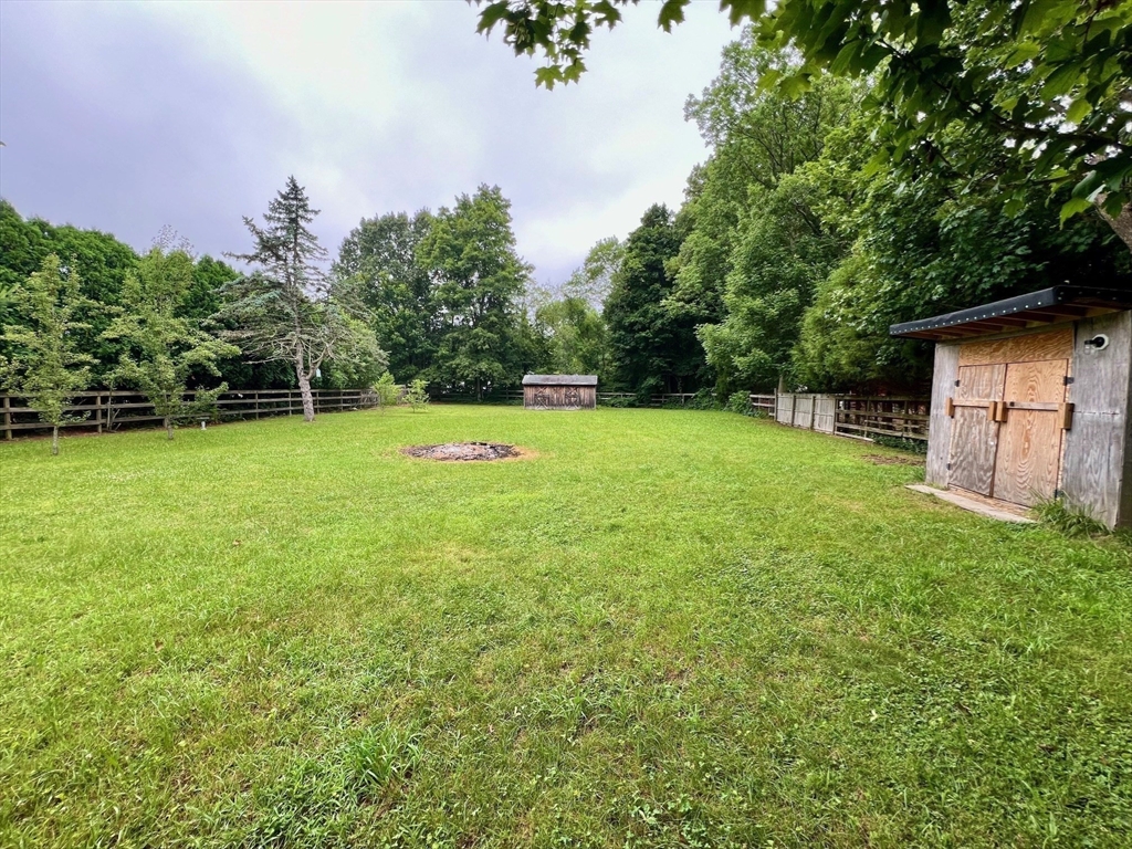 61 Center Street Bridgewater, MA 02324 - Photo 8 of 33 a view of a backyard with a small yard