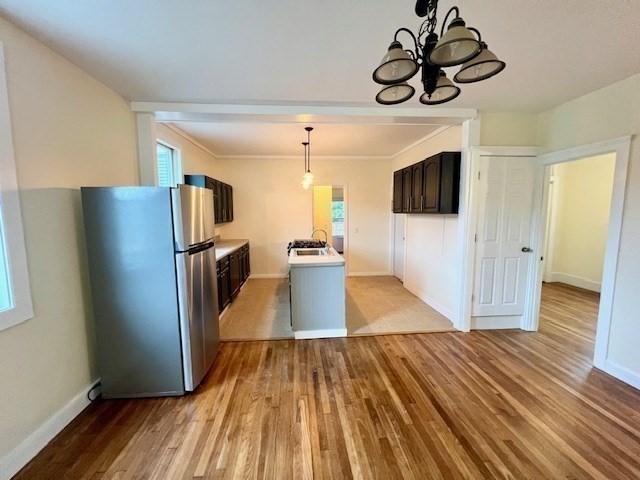 61 Center Street Bridgewater, MA 02324 - Photo 9 of 33 a view of a livingroom with wooden floor and a ceiling fan