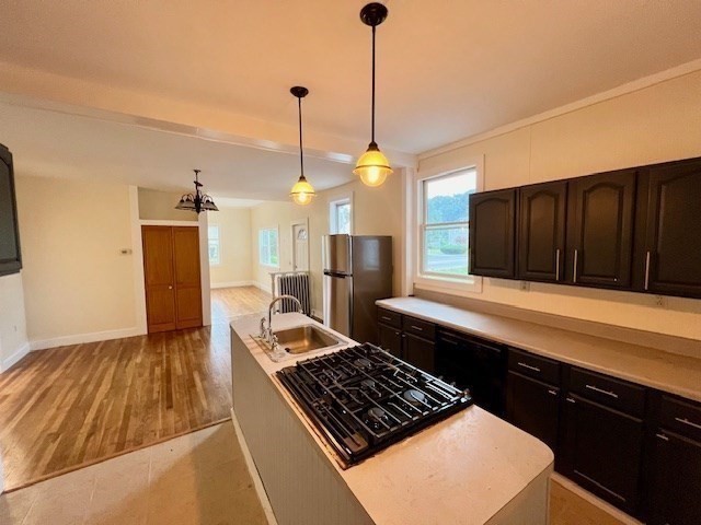 61 Center Street Bridgewater, MA 02324 - Photo 10 of 33 a kitchen with stainless steel appliances granite countertop a stove a refrigerator and a wooden cabinets