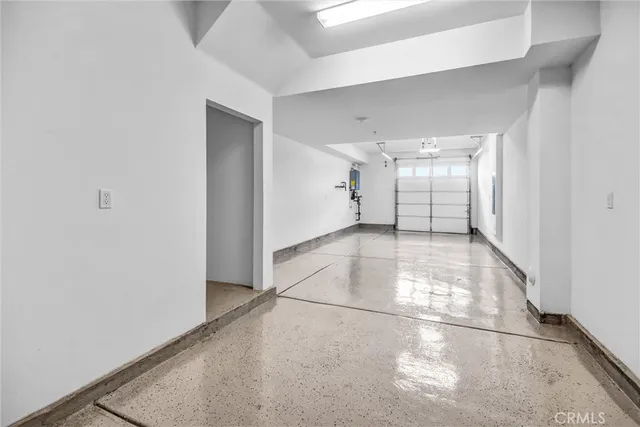 a view of a patio with table and chairs potted plants