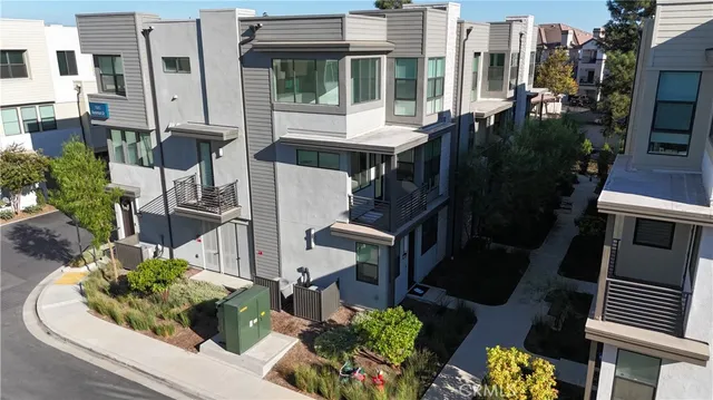 an aerial view of a house with outdoor space