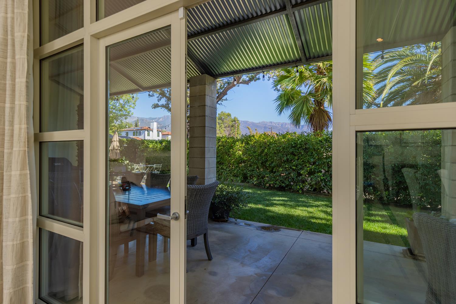 312 Fox Street Ojai, CA 93023 - Photo 13 of 43 a view of a porch with a table and chairs