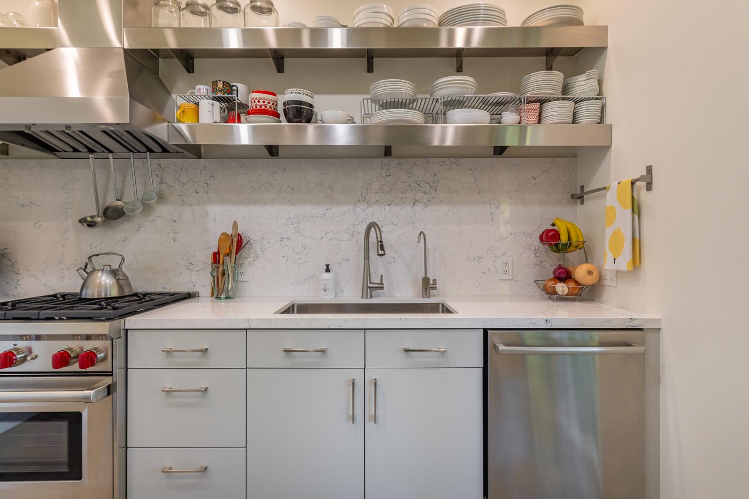 312 Fox Street Ojai, CA 93023 - Photo 20 of 43 a kitchen with stainless steel appliances granite countertop a sink dishwasher and cabinets with wooden floor