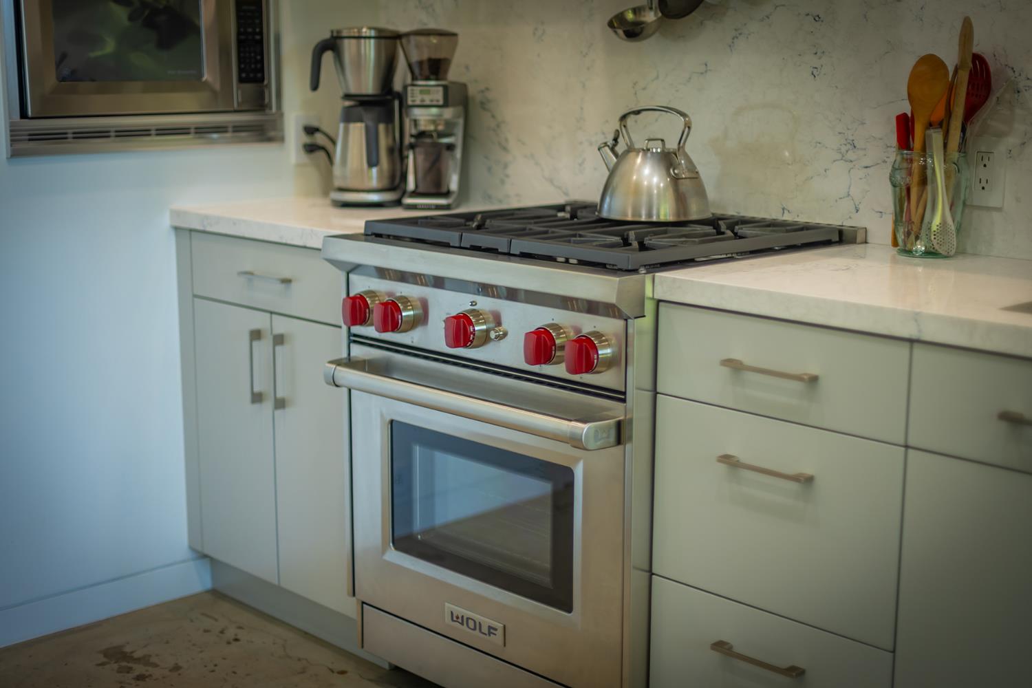 312 Fox Street Ojai, CA 93023 - Photo 21 of 43 a kitchen with a stove and cabinets