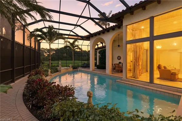 a view of swimming pool with a outdoor seating