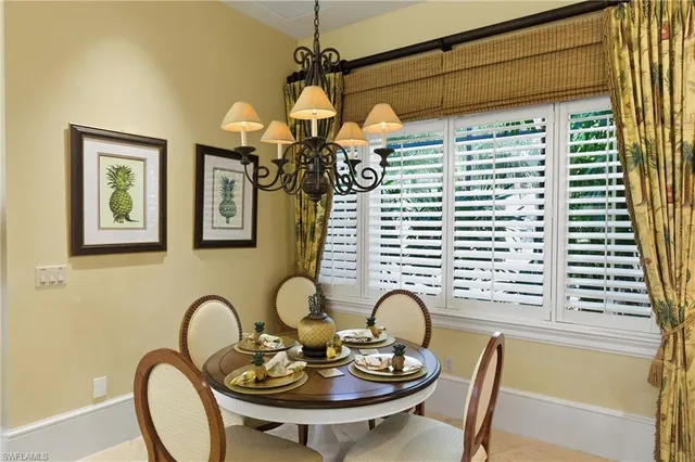a dining room with furniture and window