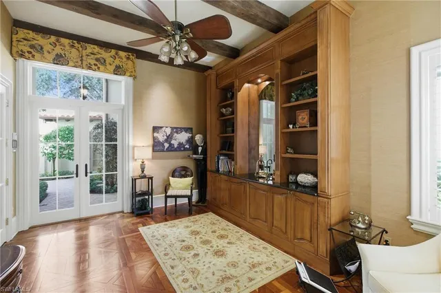 a living room with furniture rug and window
