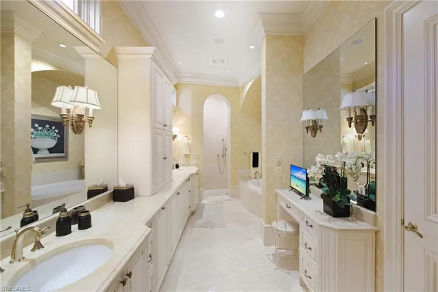 a bathroom with a double vanity sink and a mirror