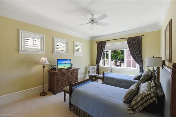 a bedroom with a bed and a couch