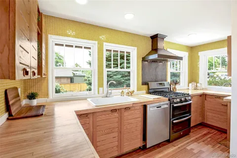 a kitchen with sink and stove