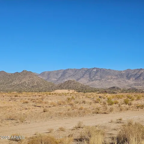 a view of ocean and mountain
