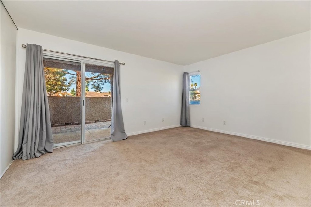 200 East Alessandro Boulevard, Unit 79 Riverside, CA 92508 - Photo 19 of 30 an empty room with windows