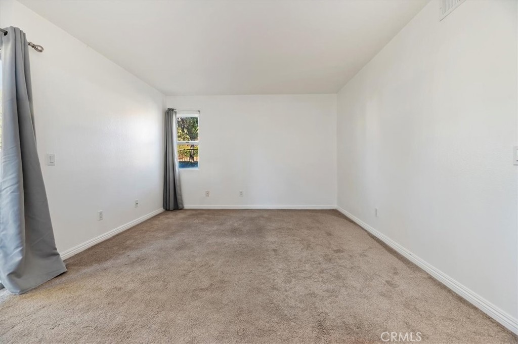 200 East Alessandro Boulevard, Unit 79 Riverside, CA 92508 - Photo 20 of 30 an empty room with a window