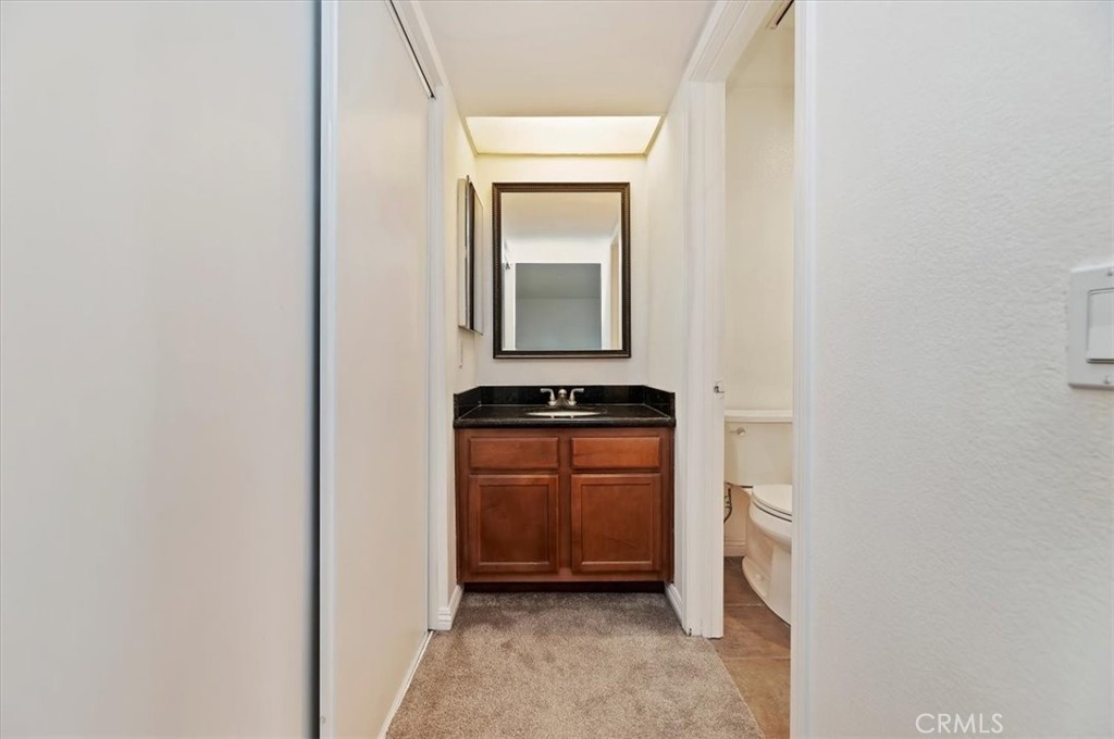 200 East Alessandro Boulevard, Unit 79 Riverside, CA 92508 - Photo 21 of 30 a bathroom with a sink and a mirror