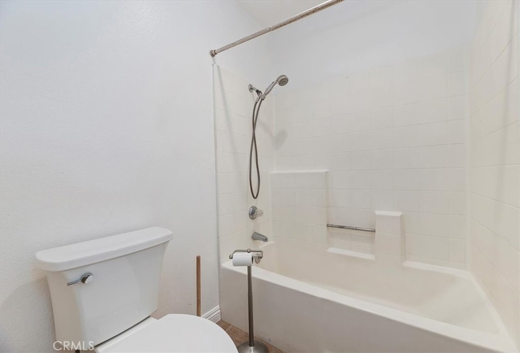 200 East Alessandro Boulevard, Unit 79 Riverside, CA 92508 - Photo 22 of 30 a white toilet sitting next to a bath tub shower