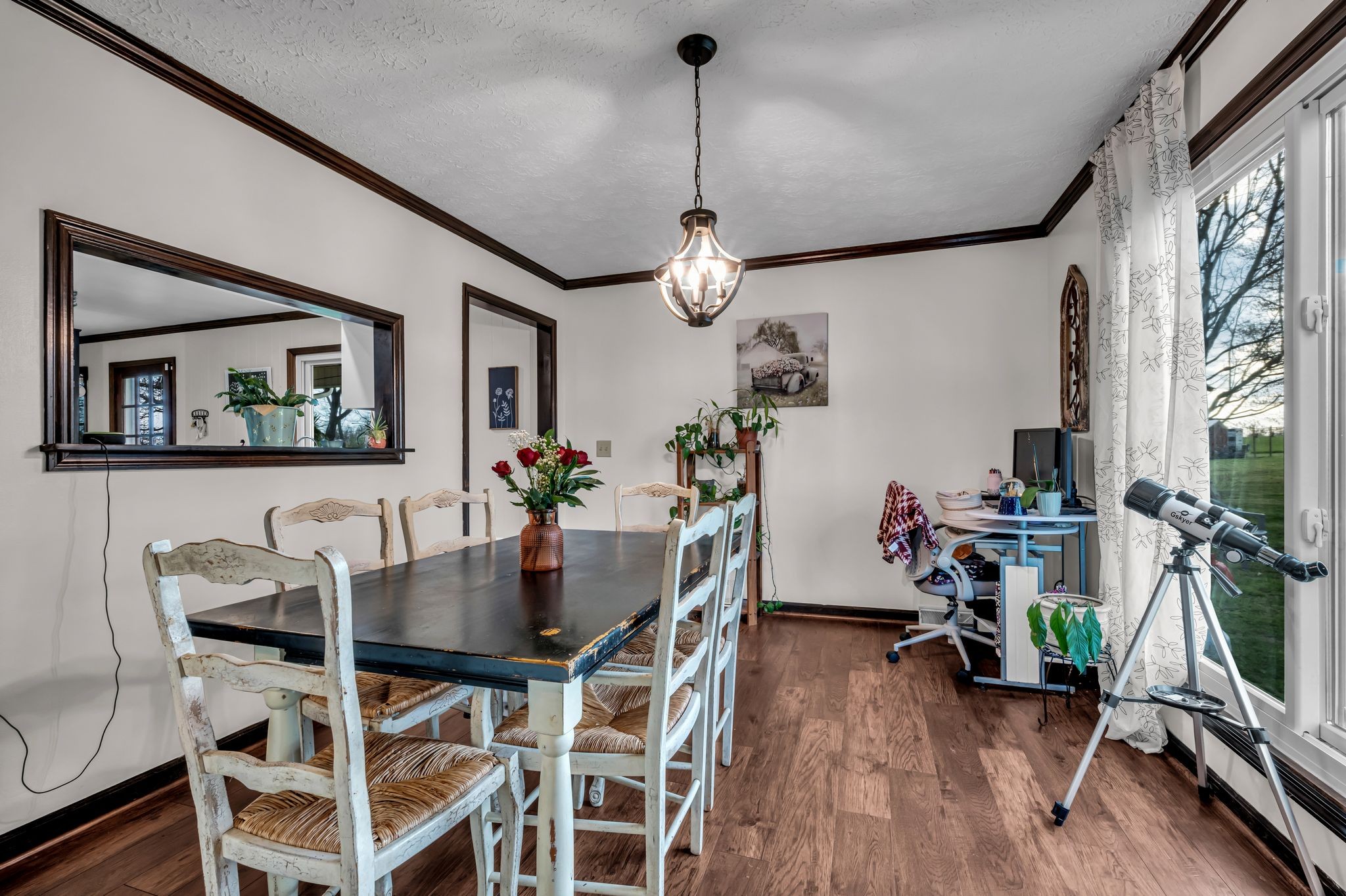2280 C C C Road Dickson, TN 37055 - Photo 11 of 35 a dining room with furniture a chandelier and wooden floor