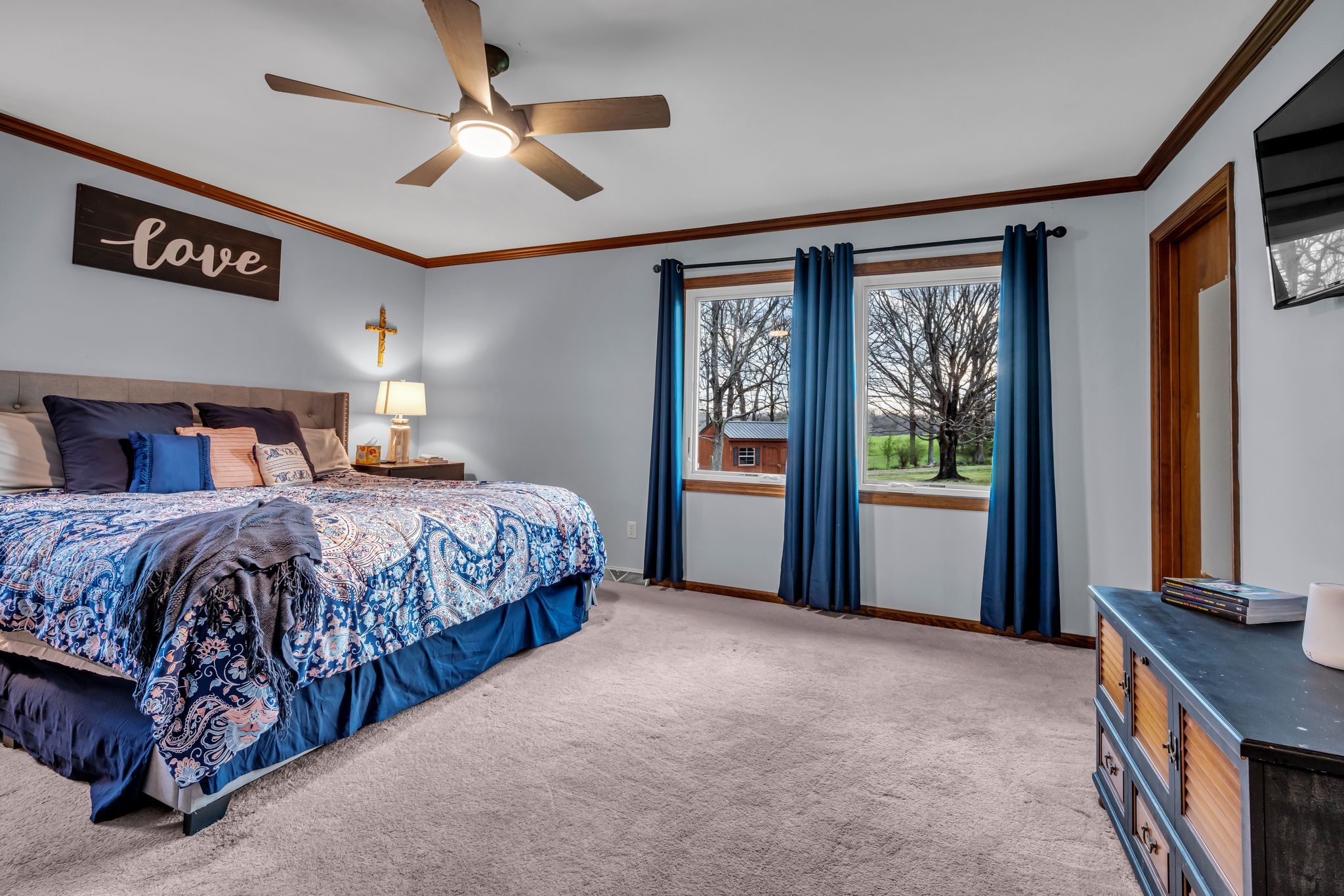 2280 C C C Road Dickson, TN 37055 - Photo 13 of 35 a bedroom with a large bed and a large window