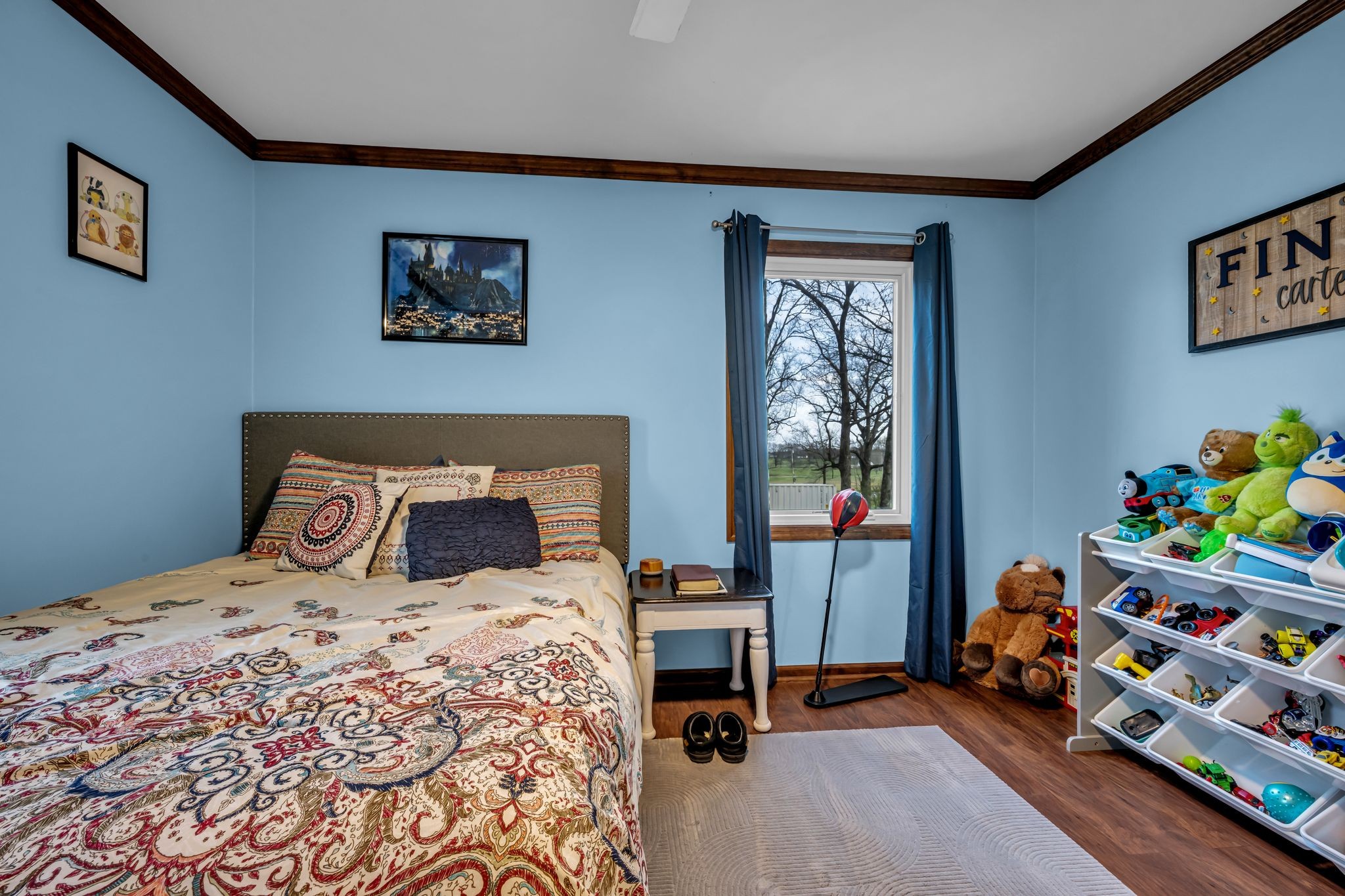 2280 C C C Road Dickson, TN 37055 - Photo 17 of 35 a bedroom with a bed and wooden floor