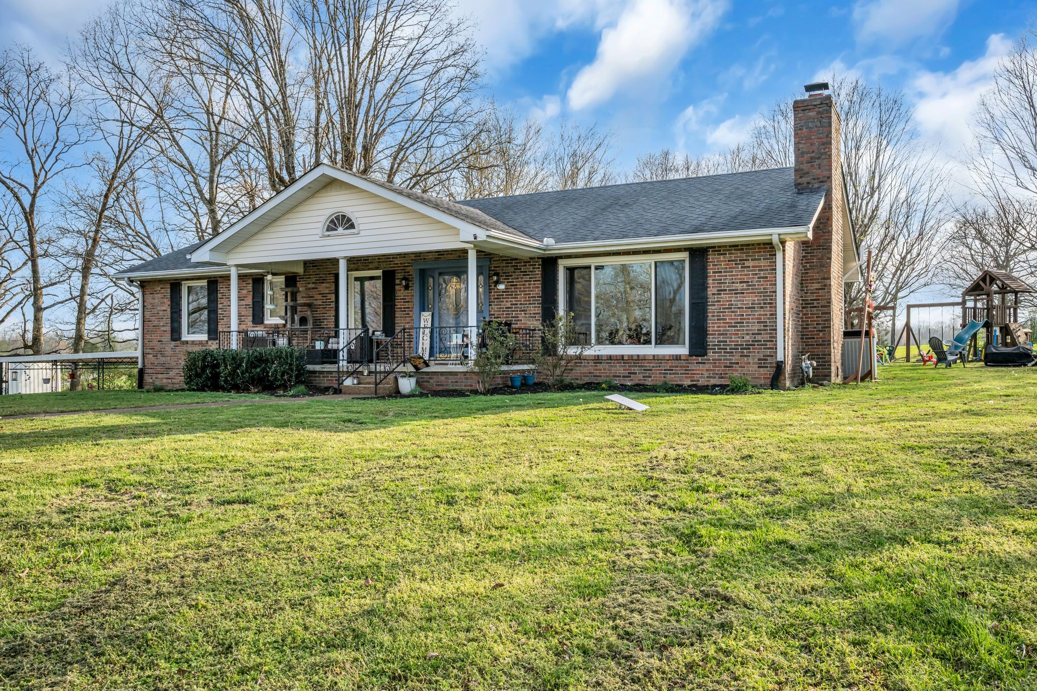 2280 C C C Road Dickson, TN 37055 - Photo 2 of 35 a front view of a house with garden