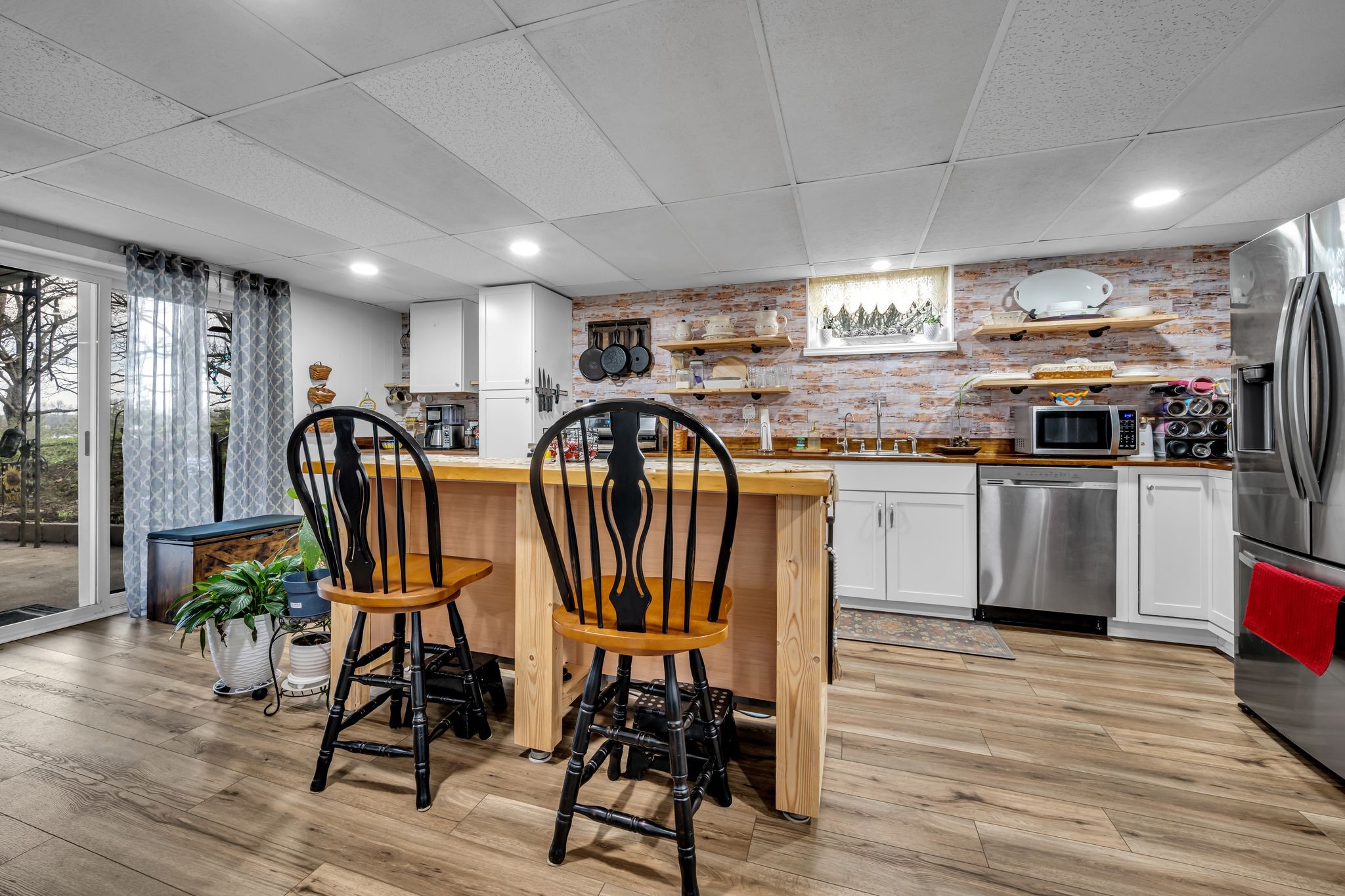 2280 C C C Road Dickson, TN 37055 - Photo 25 of 35 a kitchen with stainless steel appliances granite countertop a table chairs sink and wooden floor