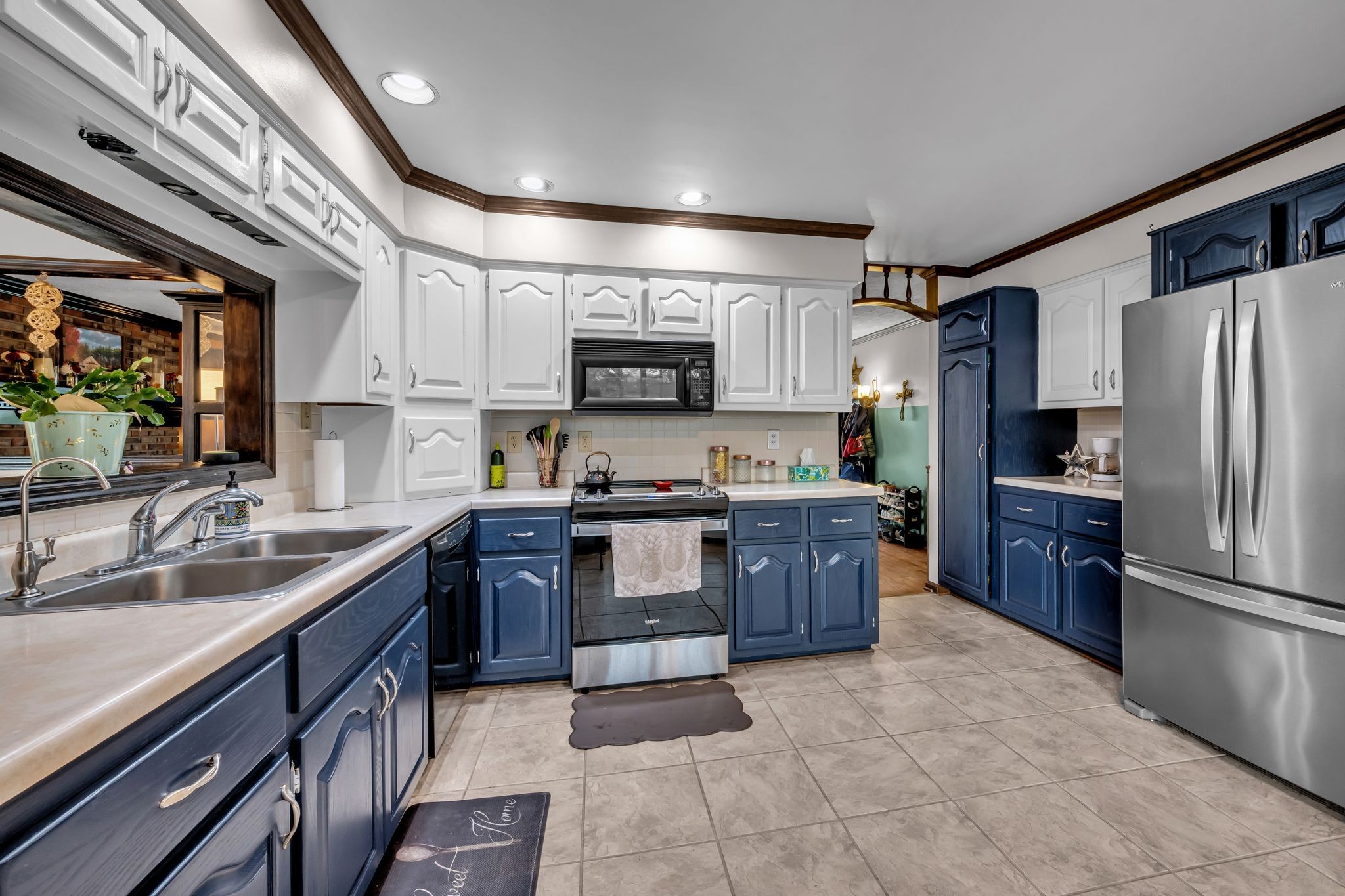 2280 C C C Road Dickson, TN 37055 - Photo 9 of 35 a large kitchen with stainless steel appliances granite countertop a stove refrigerator and a sink