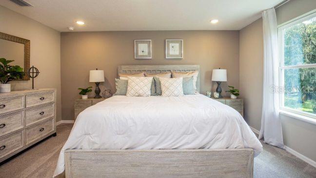 3604 Summitview Drive Lakeland, FL 33803 - Photo 12 of 23 a large white bed in a white room