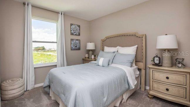 3604 Summitview Drive Lakeland, FL 33803 - Photo 14 of 23 a bedroom with a bed and a window