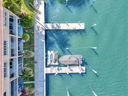 a bathroom with 2 sink toilet and a mirror