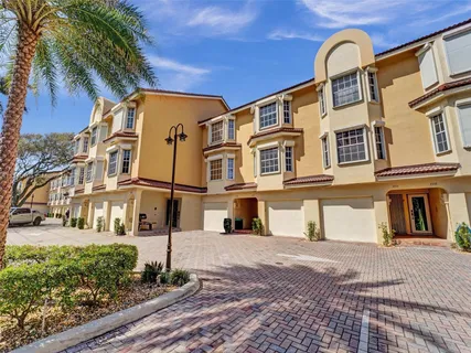 a living room with furniture and stairs