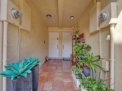 a view of a livingroom with furniture and hardwood floor
