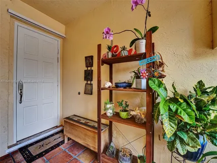 a bathroom with a toilet and a shower curtain