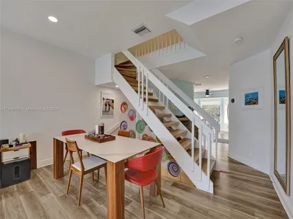 a bedroom with a bed and a painting on the wall