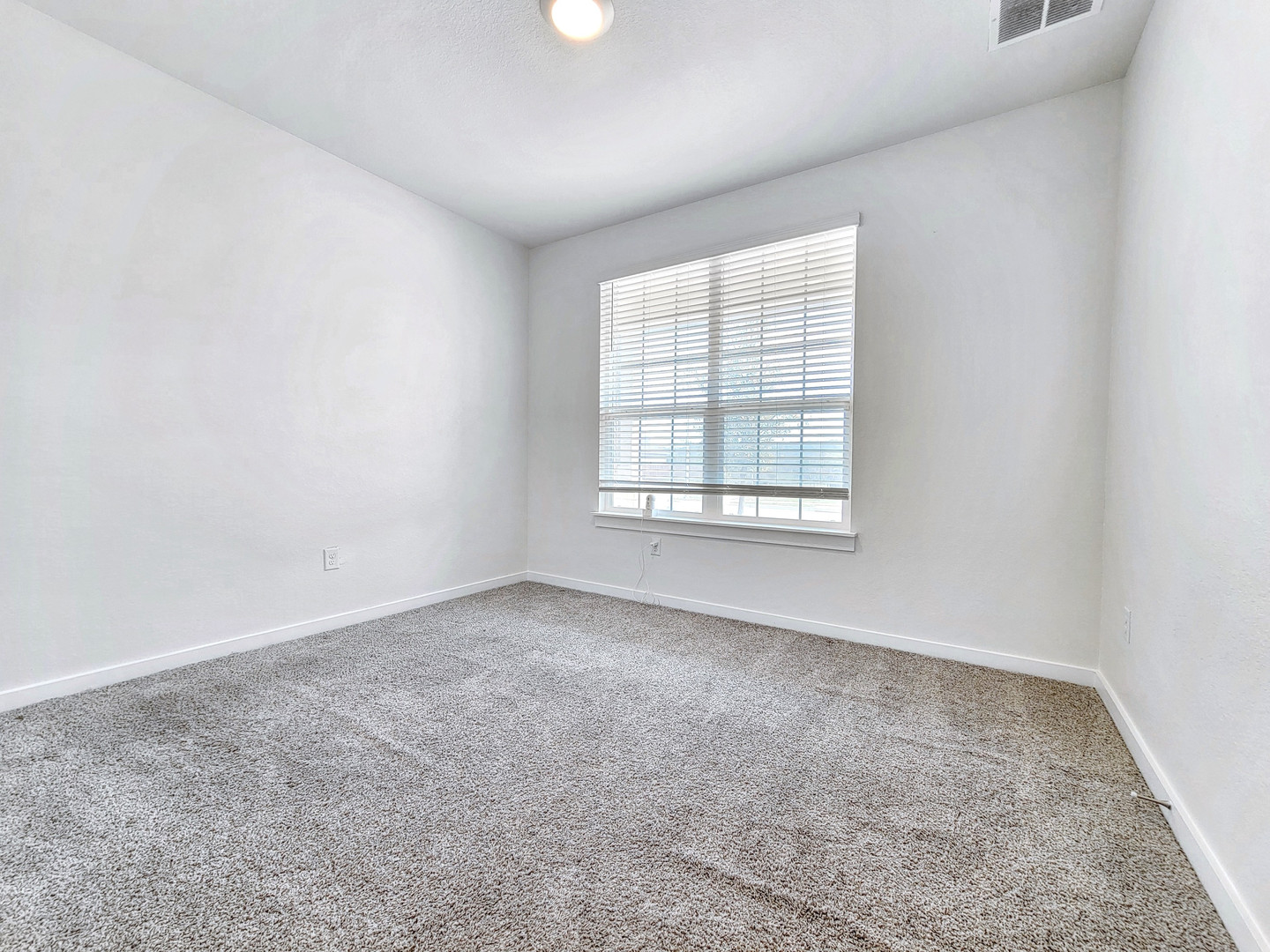 2329 Gabriels Horn Road Leander, TX 78641 - Photo 17 of 23 A well-proportioned bedroom with soft carpet and natural light filtering through window blinds.
