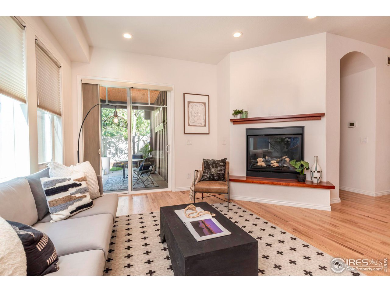 5065 3rd Street Boulder, CO 80304 - Photo 14 of 40 a living room with furniture a window and a fireplace