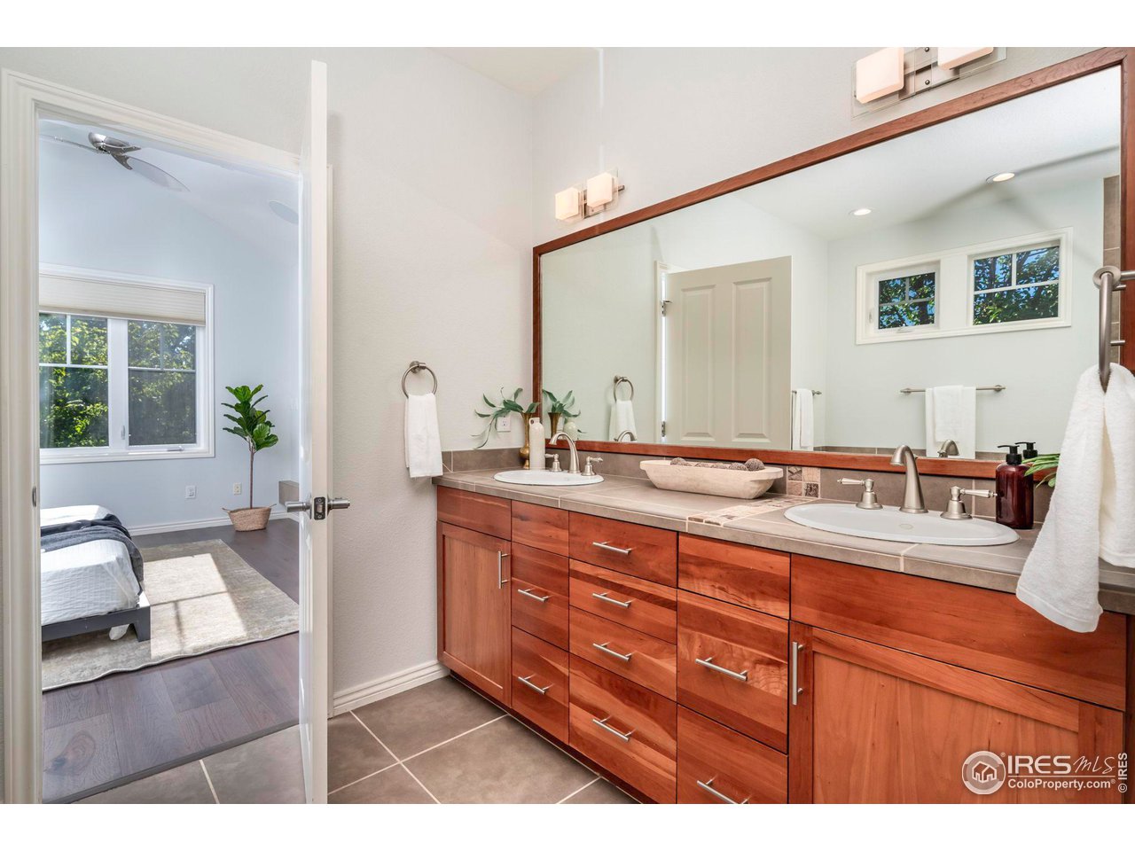 5065 3rd Street Boulder, CO 80304 - Photo 15 of 40 a bathroom with a tub sink and mirror