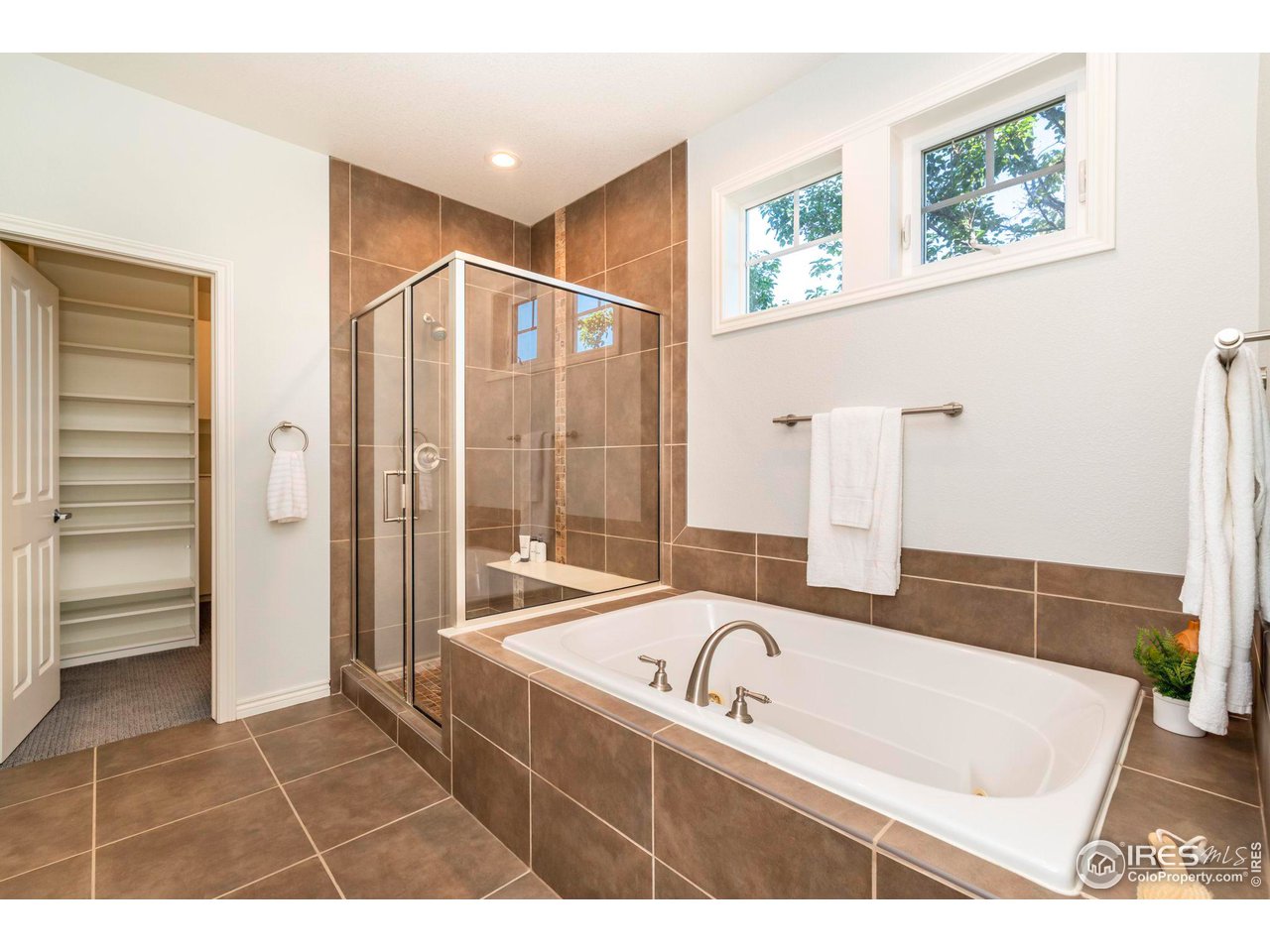 5065 3rd Street Boulder, CO 80304 - Photo 16 of 40 a bathroom with a bathtub and a shower