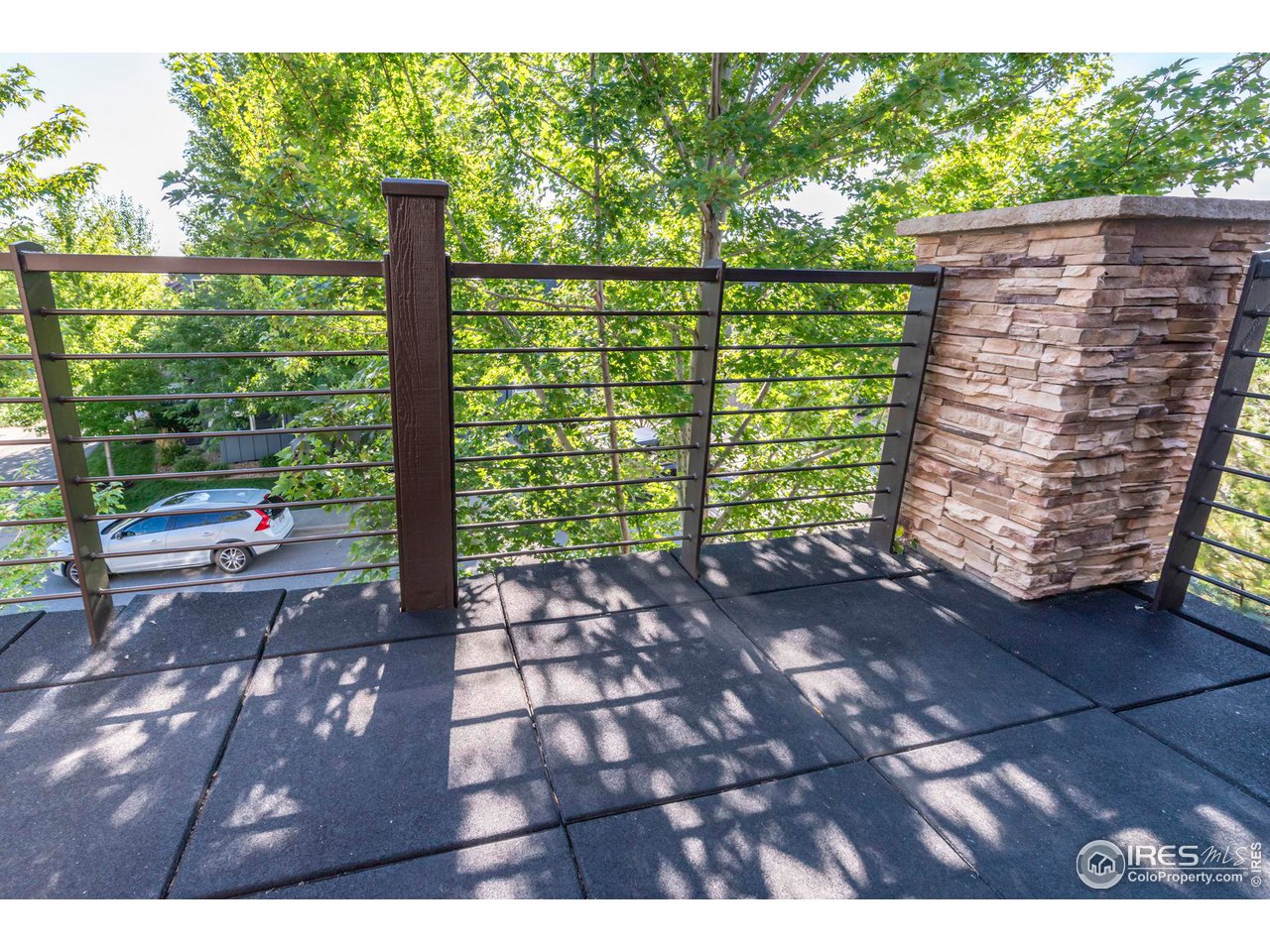 5065 3rd Street Boulder, CO 80304 - Photo 17 of 40 a view of a yard with plants and wooden fence