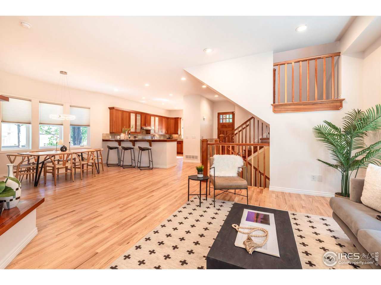 5065 3rd Street Boulder, CO 80304 - Photo 19 of 40 a living room with furniture a dining table and a potted plant