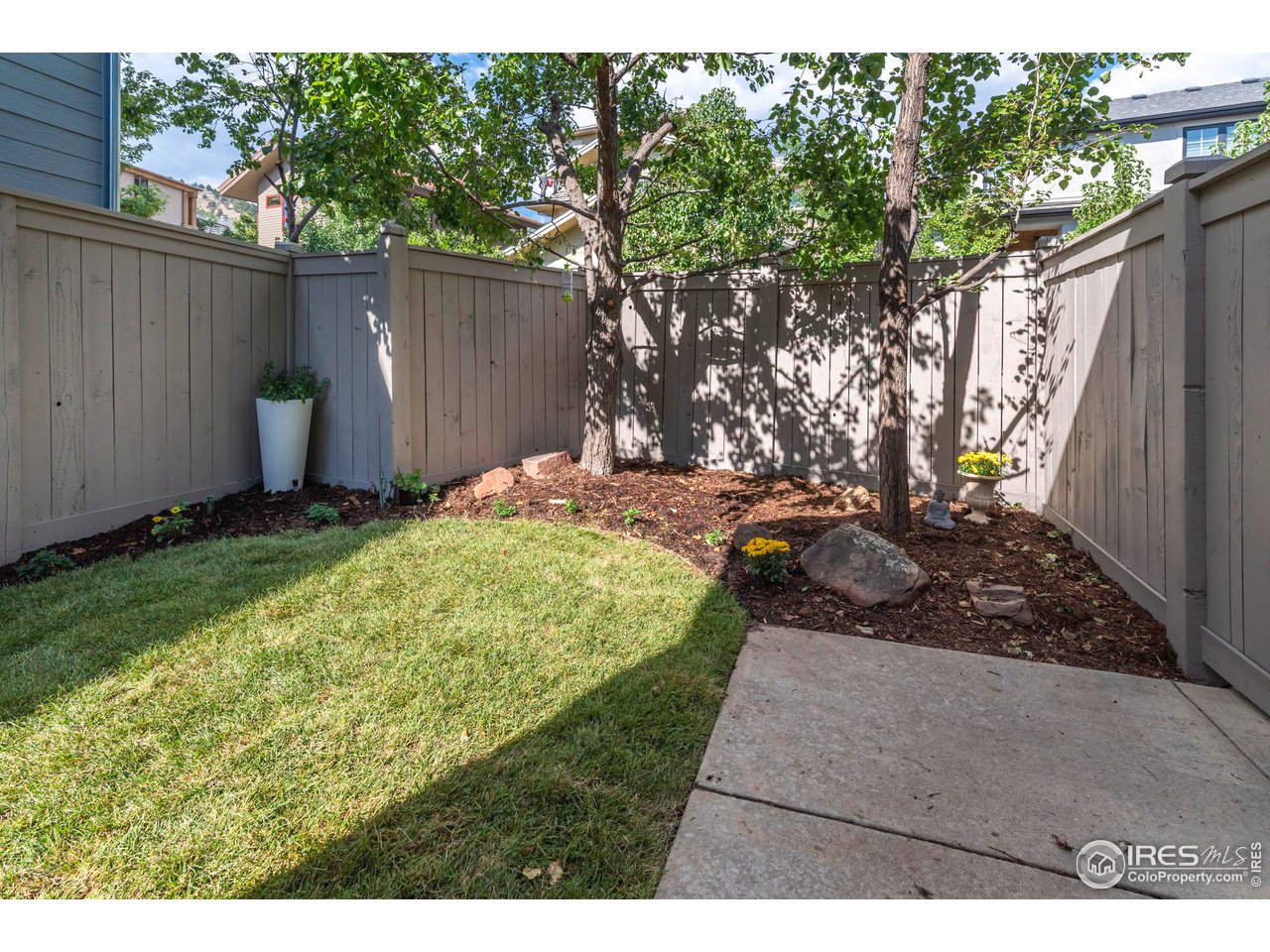 5065 3rd Street Boulder, CO 80304 - Photo 24 of 40 a view of a backyard with wooden fence