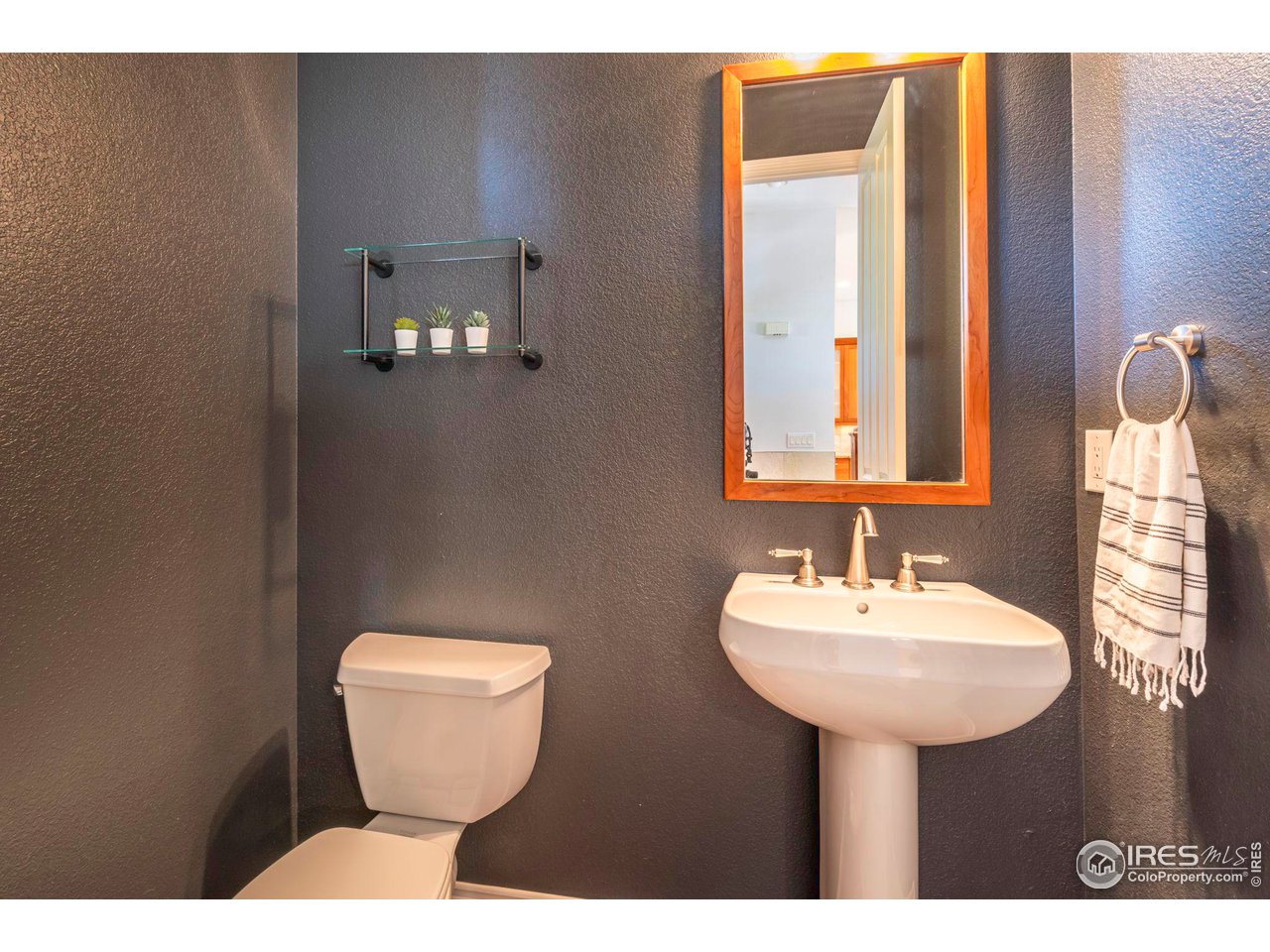 5065 3rd Street Boulder, CO 80304 - Photo 30 of 40 a bathroom with a sink a toilet and mirror