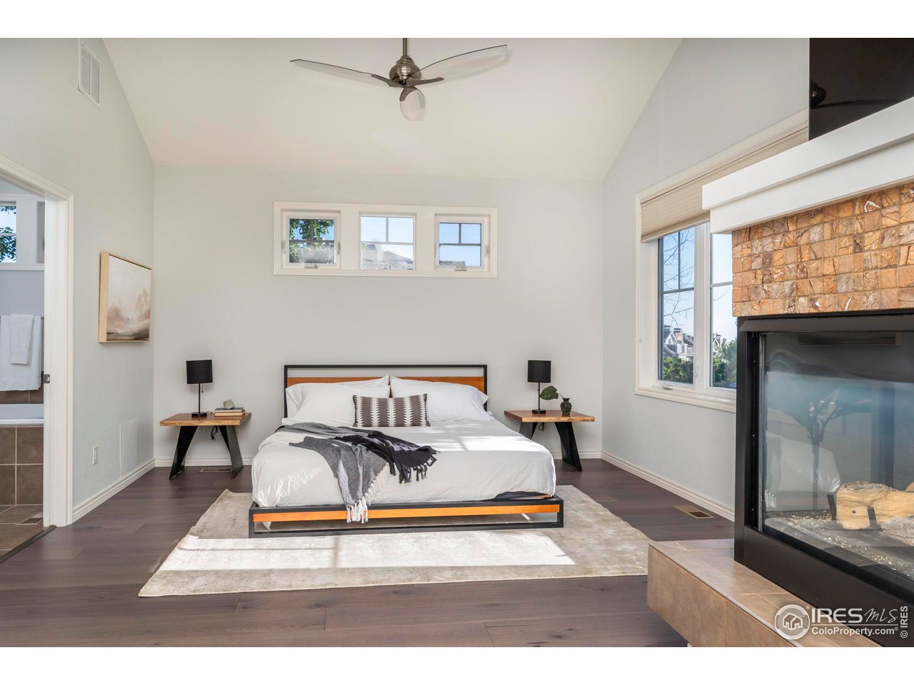 5065 3rd Street Boulder, CO 80304 - Photo 3 of 40 a living room with furniture a table and wooden floor