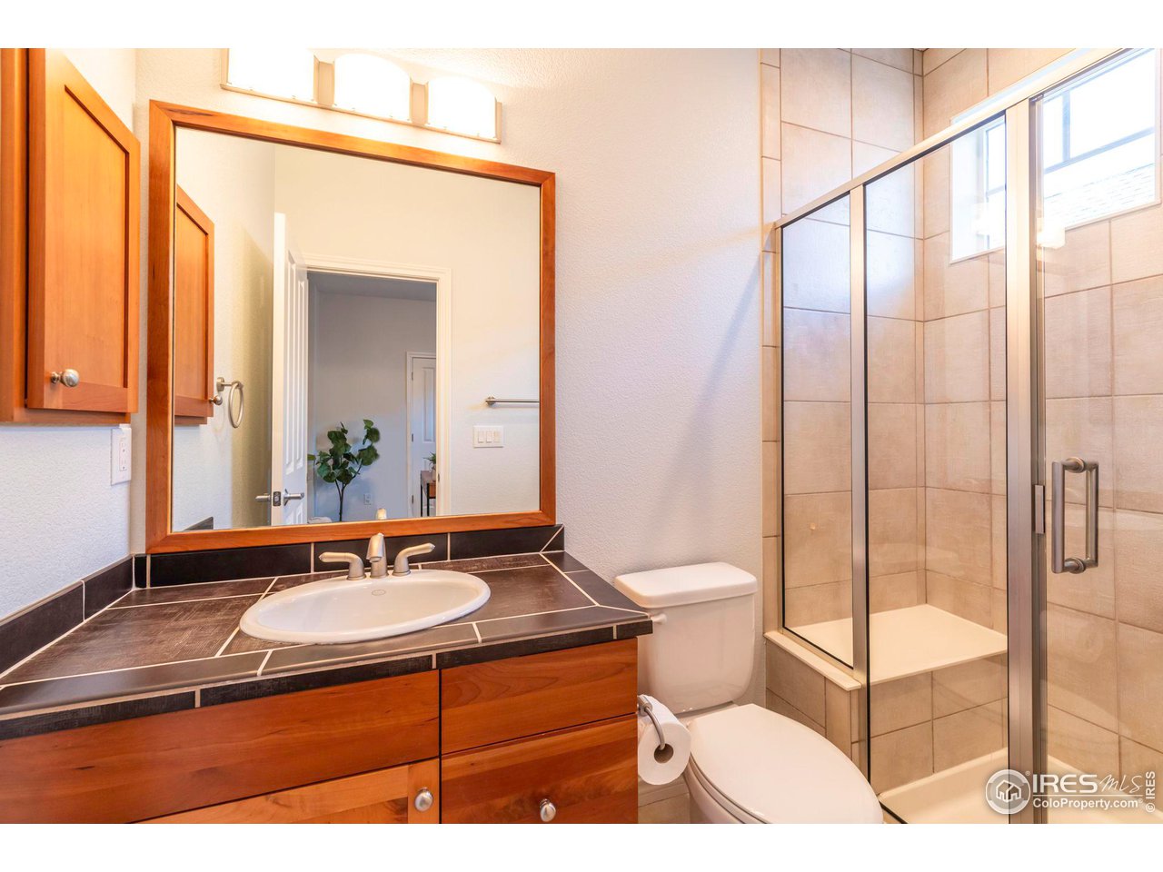 5065 3rd Street Boulder, CO 80304 - Photo 33 of 40 a bathroom with a sink toilet and shower