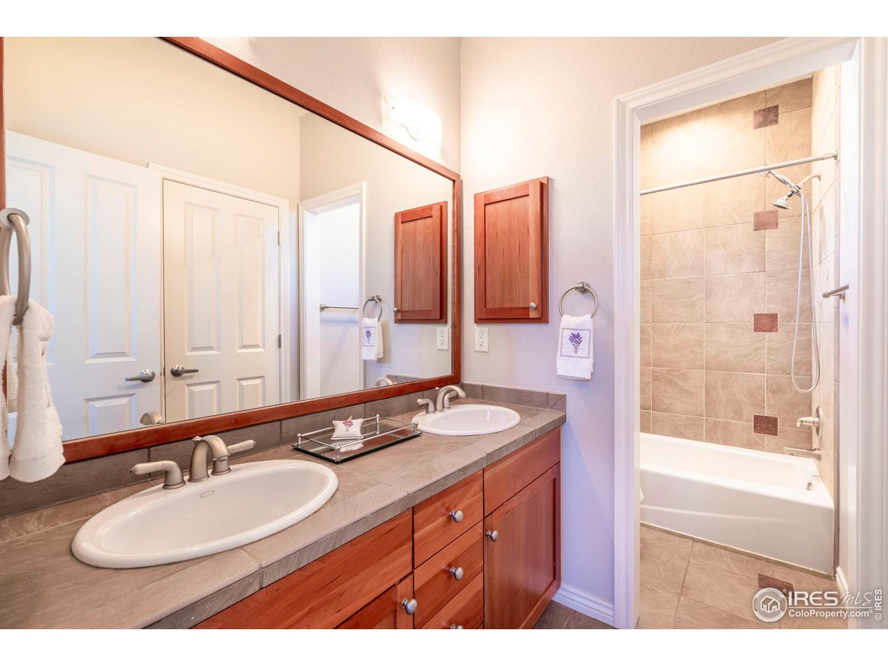 5065 3rd Street Boulder, CO 80304 - Photo 36 of 40 a bathroom with a granite countertop sink mirror and a
